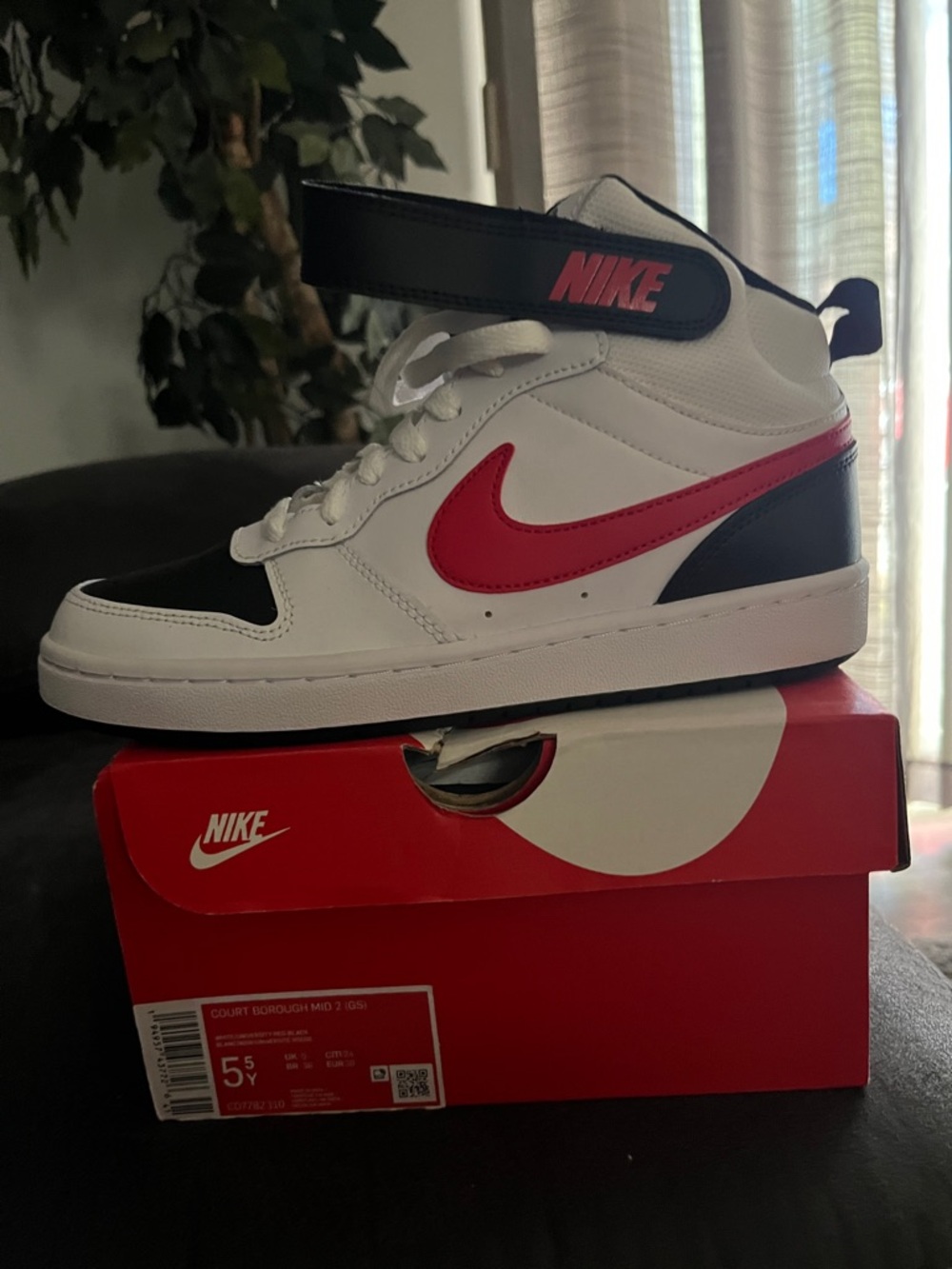 Nike Mid-Top Sneakers in White, Black & Red Swoosh